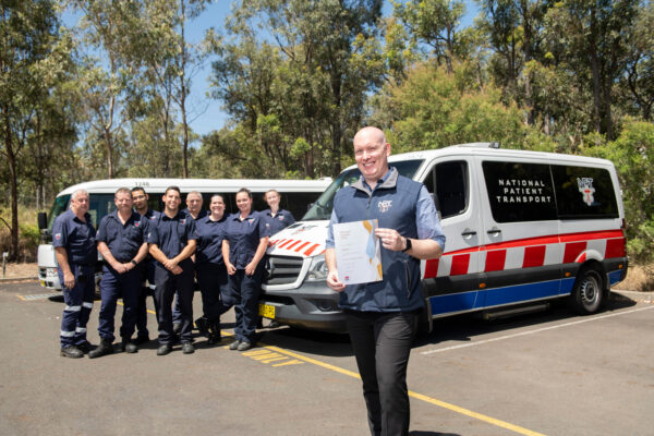 NSW Manager Adam Orchard, With Some Of Our NSW Staff, Pictured With The NSW Premier’s Award For Our COVID 19 And Discharge Shuttle Service